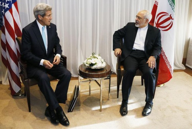 The Iranian Minister of Foreign Affairs Mohammad Javad Zarif (on the right) and the U.S. Secretary of State John Kerry, Geneva, 14th of January, 2015 – Credit Rick Wilking / AFP